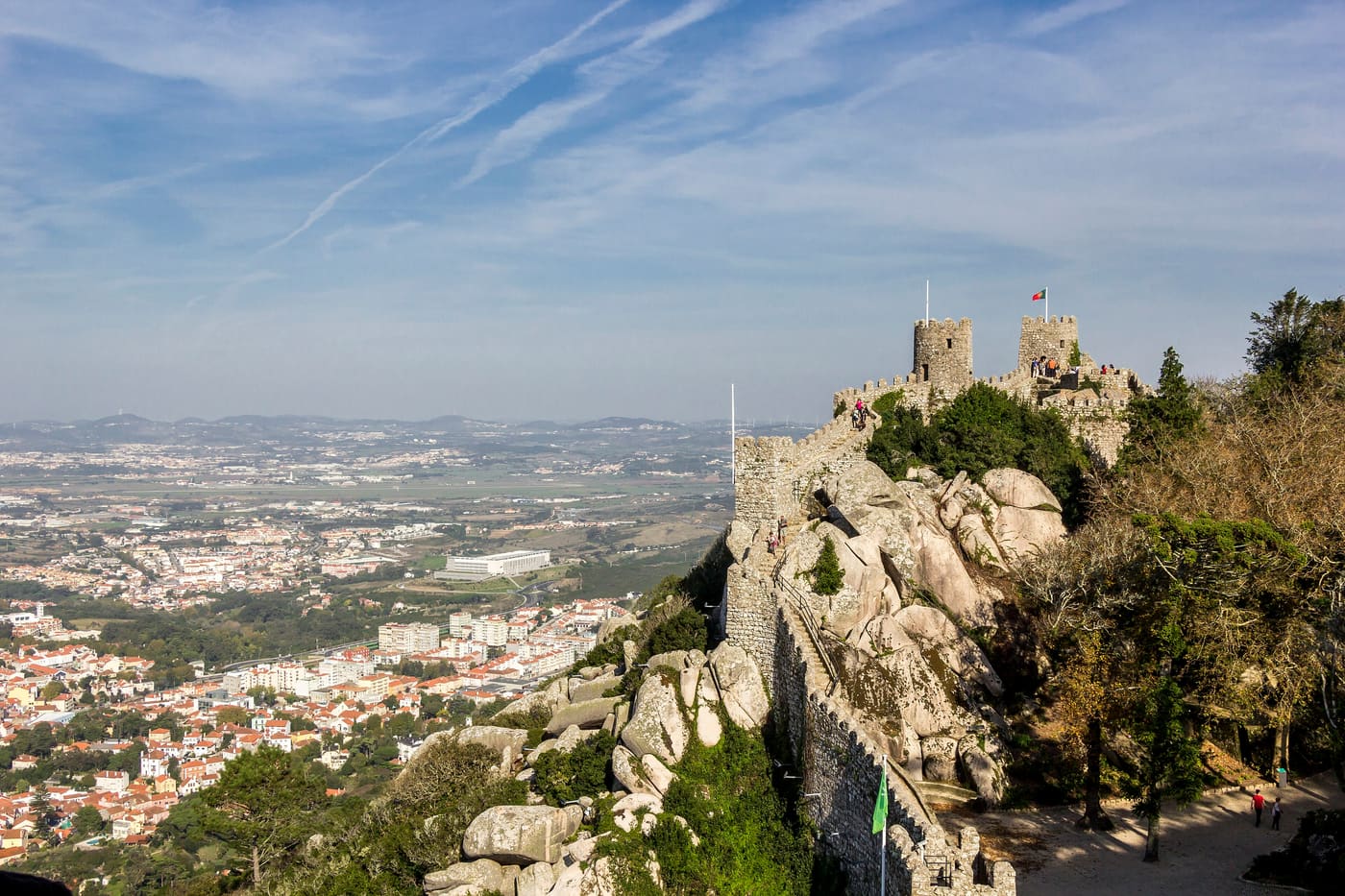 The walls of the Moorish Castle in Sintra with the town below